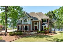 Spacious two-story home with a well-kept lawn and mature trees at 513 Viridian Vw, Peachtree City, GA 30269
