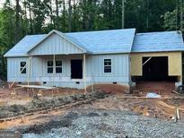 New construction of a home with light gray siding and an attached two-car garage at 22 Summer Ct, Carrollton, GA 30116