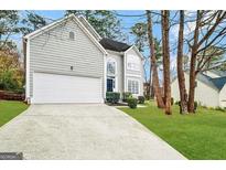 Charming two-story home with a well-manicured lawn, two car garage, and inviting curb appeal at 2578 Lavender Ct, Decatur, GA 30034