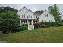 Charming two-story home with a beautifully landscaped front yard, perfect for curb appeal at 22 Shea Ct, Douglasville, GA 30134