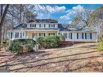 Charming two-story home with a landscaped front yard and a classic architectural style at 3341 Deer Hollow Sw Trl, Conyers, GA 30094