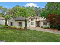 Charming home with mature landscaping, attached garage, and lovely curb appeal at 2698 Pleasant Grove Church Rd, Villa Rica, GA 30180