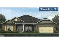 Charming single-story brick home with attached two-car garage, manicured lawn, and traditional architectural details at 348 Charles Ridge, Dallas, GA 30157