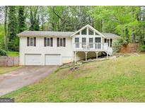 Charming exterior of a two story home featuring a two car garage and inviting front porch at 3861 Hanover Ct, Marietta, GA 30062