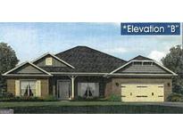 Charming single story home featuring a symmetrical facade, attached two car garage, and traditional architectural details at 314 Charles Ridge, Dallas, GA 30157