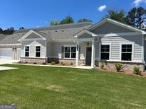 Charming single-story home featuring a well-manicured lawn and inviting neutral-toned exterior at 3708 Cheswolde Ave # 95, Powder Springs, GA 30127