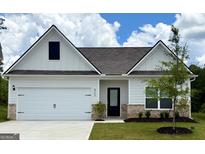Charming single-story home with a two-car garage and well-manicured lawn at 423 Prescott Way, Villa Rica, GA 30180