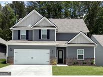 Two-story home featuring gray siding, white trim, black shutters and a two car garage at 443 Prescott Way, Villa Rica, GA 30180