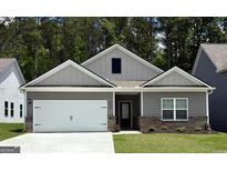 Charming single-story home featuring a white garage door and gray siding, complete with a well-manicured lawn at 445 Prescott Way, Villa Rica, GA 30180
