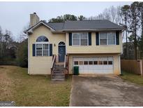 Charming two-story home featuring a traditional design with a two car garage and inviting front entrance at 1119 Oakwood Manor Ct, Decatur, GA 30032