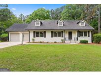 Charming one-story home with a well-manicured lawn and inviting curb appeal at 380 Grady Ave, Fayetteville, GA 30214