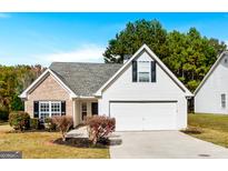 Charming single-Gathering home boasts a well-manicured lawn and a two-car garage, perfect for modern living at 1716 Anniston Dr, Mcdonough, GA 30253