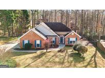 Charming one-story brick home with a well-manicured front yard and blue shutters at 418 Crosshaven Way, Mcdonough, GA 30253