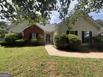 Charming single-Gathering home with tidy landscaping and a welcoming front porch at 308 Dylan Way, Mcdonough, GA 30252