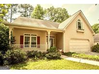 Charming single-Gathering home featuring a welcoming front porch and an attached garage with lovely curb appeal at 4481 Mccart Cv, Stone Mountain, GA 30083