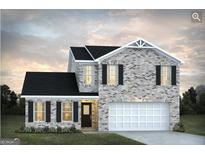 Charming two-story home boasting a classic brick facade, black shutters, and an attached two-car garage at 5322 Tolar Rd # 27, South Fulton, GA 30213