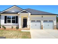 Charming single-Gathering home featuring a 2-car garage, neutral paint, and a welcoming front entrance at 346 Friendship Oak Way, Hampton, GA 30228