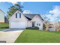 Charming single-Gathering home with a well-maintained lawn and attached two-car garage at 6861 John Clark Dr, Douglasville, GA 30134