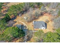 Beautiful home on large lot with mature trees and outbuildings offering privacy and space to enjoy outdoor activities at 3725 Concord Rd, Newborn, GA 30056