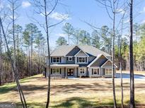 New construction home with a large manicured lawn and mature trees at 980 Temple Draketown Rd, Temple, GA 30179