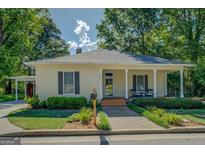 Charming single-story home featuring a covered porch, neutral siding, and well-maintained landscaping in a desirable location at 3170 Butler Se Ave, Covington, GA 30014