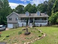 Charming house with a quaint front yard and a cozy covered porch at 1137 Eagles Nest Cir, Carrollton, GA 30116