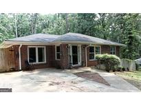 Charming brick home with a well-maintained front yard and a welcoming entrance at 288 Harper Se Rd, Atlanta, GA 30315