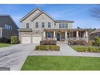 Charming two-story home with a welcoming front porch and manicured lawn at 3213 Blackley Old Rd, Douglasville, GA 30135