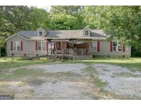 Charming single-Gathering home featuring a welcoming front porch and well-maintained exterior at 714 Yates Rd, Bowdon, GA 30108
