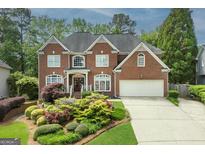 Charming two-story brick home with well-maintained landscaping and a two-car garage at 6317 Benbrooke Nw Overlook, Acworth, GA 30101