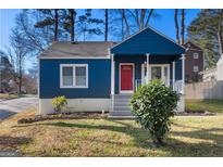 Charming blue home with a red front door and a cozy front porch at 2584 Oldknow Nw Dr, Atlanta, GA 30318