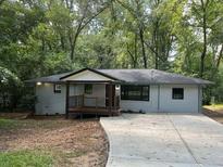 Charming ranch-style home with a welcoming front porch and well-maintained lawn at 2953 Meadowview Se Dr, Atlanta, GA 30316