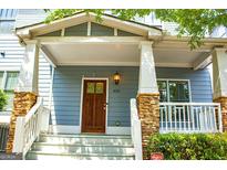 Inviting front porch with stone accents and craftsman details enhance the curb appeal at 625 Chestnut St # D, Hapeville, GA 30354