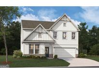 Charming two-story home with vertical siding, brick accents, and a two-car garage at 502 Regency Trl, Acworth, GA 30102