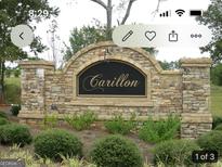 Stone community sign with the neighborhood name 'Carillon' displayed at 1128 Carillon Se Dr, Conyers, GA 30013