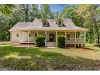 Charming traditional home featuring a welcoming porch and well-maintained front yard at 145 County Line Ct, Fayetteville, GA 30215