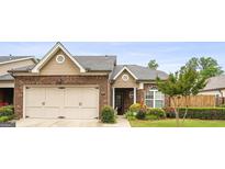 Charming brick home with well-maintained landscaping, a two-car garage, and a welcoming front porch at 3206 Abbott Dr # 12, Powder Springs, GA 30127