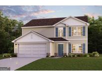 Charming two-story home with a two-car garage, manicured lawn, and decorative shutters at 4670 Sunrise Rdg, Covington, GA 30016