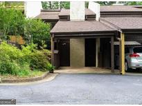 Townhome with a covered carport and well-maintained landscaping at 53 Cobblestone Crk, Peachtree City, GA 30269