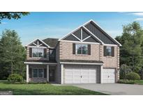 Charming two-story brick home with a three-car garage, well-manicured lawn, and classic architectural details at 1246 Trombone Way # 111, Mcdonough, GA 30252