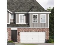 Charming two-story home showcasing a two-car garage and mixed brick and siding facade at 2020 Piccolo Ct # 229, Mcdonough, GA 30252