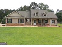 Inviting single-story home with a well-manicured lawn and charming curb appeal at 376 Turner Cir, Mcdonough, GA 30252
