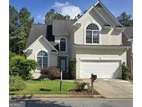 Charming stucco two-story home with well-manicured lawn and attached two-car garage at 3773 Summer Rose Dr, Atlanta, GA 30341