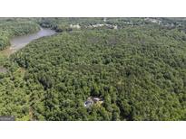 Secluded home site surrounded by lush, mature trees offers privacy and tranquility at 5780 Pumkintown Rd, Douglasville, GA 30135