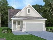 Charming single-Gathering home with a gray two-car garage, complemented by manicured landscaping and a cozy front porch at 1818 Butterfly Way, Marietta, GA 30066