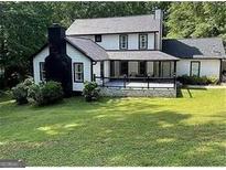 Charming two-story home with black trim and a spacious front yard at 172 Oak Forest Se Dr, Smyrna, GA 30082