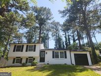 Charming two-story home featuring a well-maintained lawn and traditional architectural design at 2615 Old South Ct, Jonesboro, GA 30236