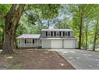 Charming two-story home featuring a covered porch, stone accents and a two car garage at 2894 Cushing Ct, Jonesboro, GA 30236
