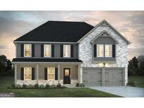 Charming two-story home features a classic design with a welcoming front porch and attached two-car garage at 1672 Fuma Leaf Way Rd, Mcdonough, GA 30253