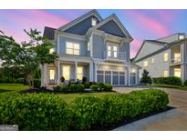 Stunning two-story home featuring a three-car garage and a charming second-story balcony at 229 Widener Way, Peachtree City, GA 30269